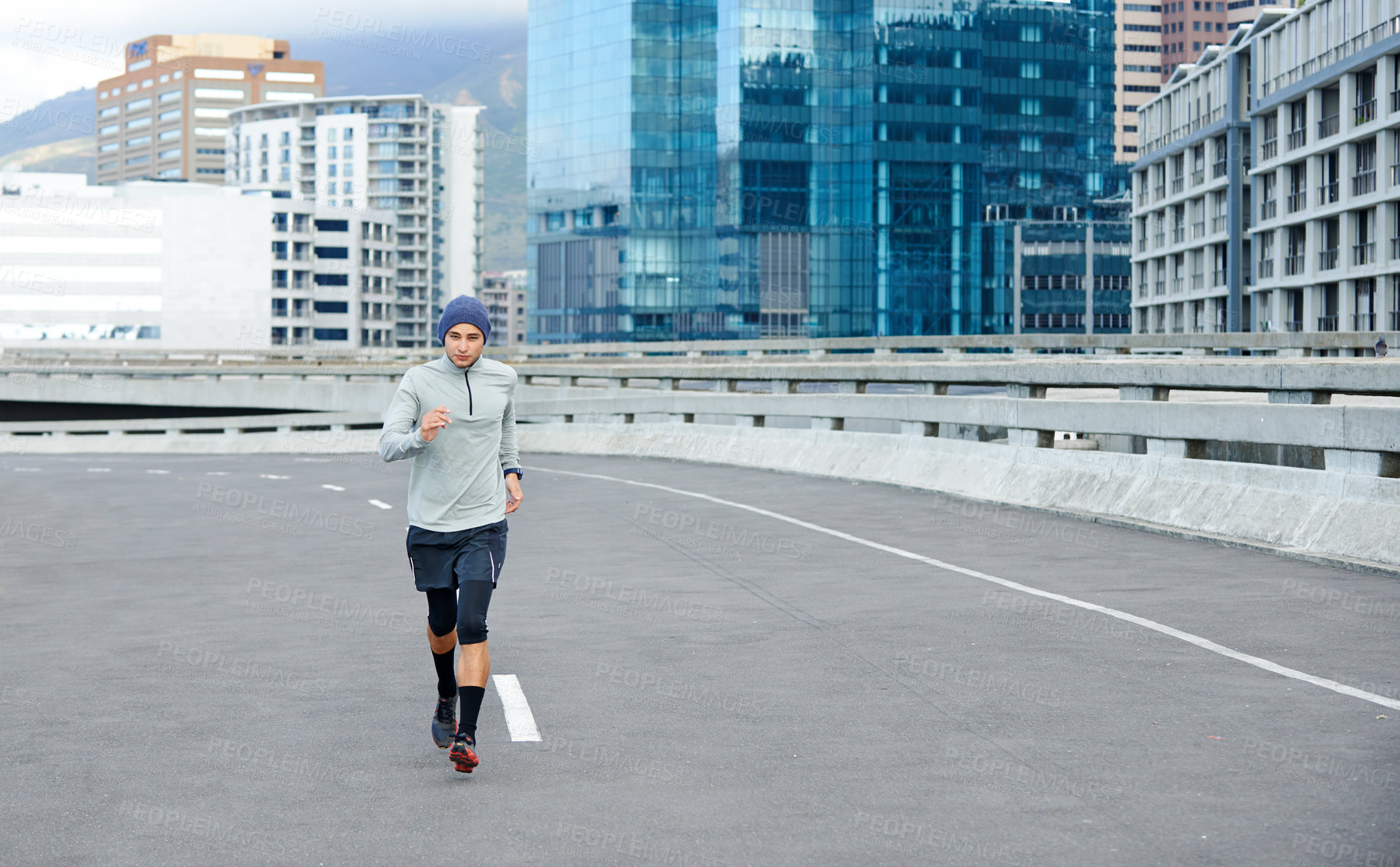 Buy stock photo Fitness, running and portrait of man on road for cardio, exercise and training space for healthy body. Sports, race and runner in city outdoor for wellness, energy and workout on bridge in Argentina