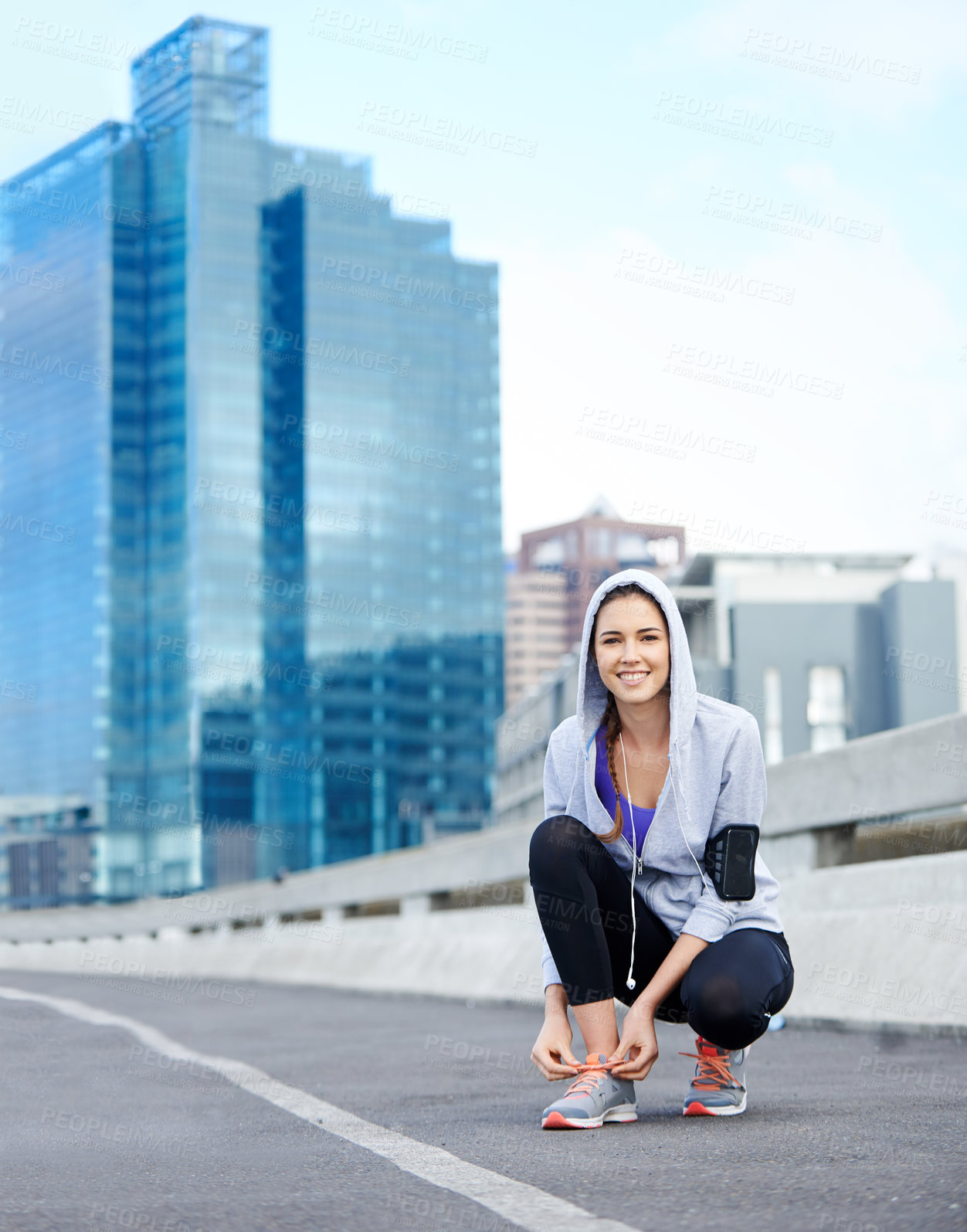 Buy stock photo Woman, exercise and portrait in city for running, sports or training on street or road. Health, tying shoes and runner or female athlete getting ready for exercise, fitness or cardio with music