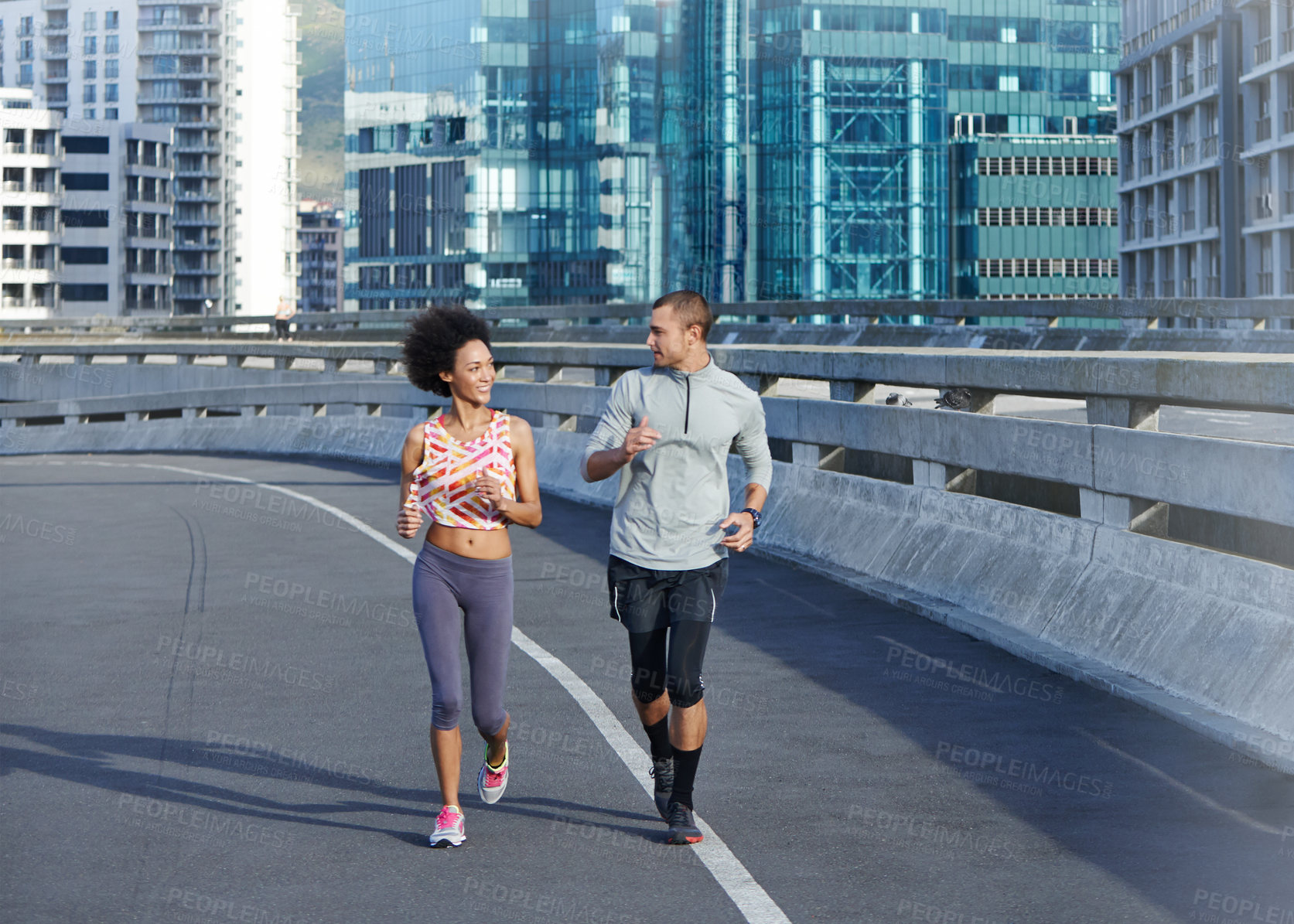 Buy stock photo City, marathon and couple with running for fitness, endurance and health benefits with training on road. Bridge, man and woman with support for cardiovascular exercise, burn calories and wellness