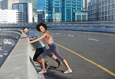 Buy stock photo Road, portrait and couple with stretching for fitness, exercise and preparation for training challenge in city. Bridge, man and woman with body warm up for running, marathon competition and wellness