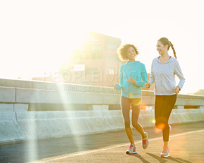 Buy stock photo Woman, friends and running with road in fitness for workout, training or outdoor exercise together. Young, female person or runners enjoying cardio, sprint or sunshine for health and wellness in town