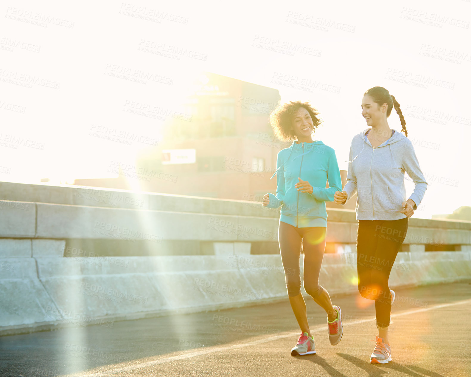 Buy stock photo Woman, friends and running with road in fitness for workout, training or outdoor exercise together. Young, female person or runners enjoying cardio, sprint or sunshine for health and wellness in town