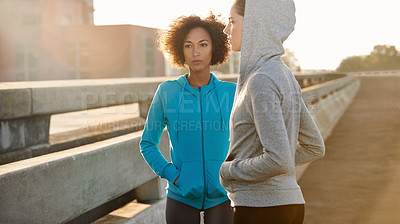 Buy stock photo Runner, women and together in street at sunrise, bridge or thinking for fitness, training and health in morning. People, direction and start workout in city for exercise, team and ready for marathon