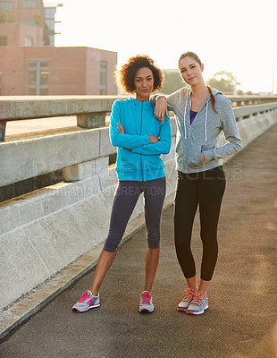 Buy stock photo Fitness, portrait and women with confidence in city for workout, training or outdoor exercise together. Young, female person or runners with smile or arms crossed for run or cardio in an urban town