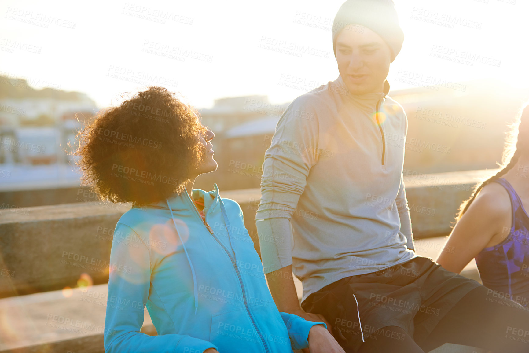 Buy stock photo Friends, talking and team in city for fitness, exercise and running session for marathon challenge outdoor. Bridge, man and women by sunshine for wellness goals, jog break and bonding together