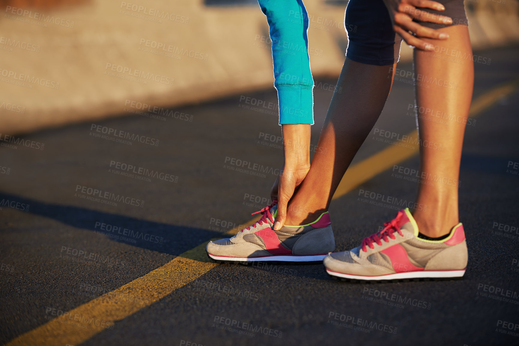 Buy stock photo Person, legs or road for fitness in sneakers, stretching or ready for exercise. Athlete, hands or touch feet on street for wellness, start or running shoes for sport with outdoor activity for health