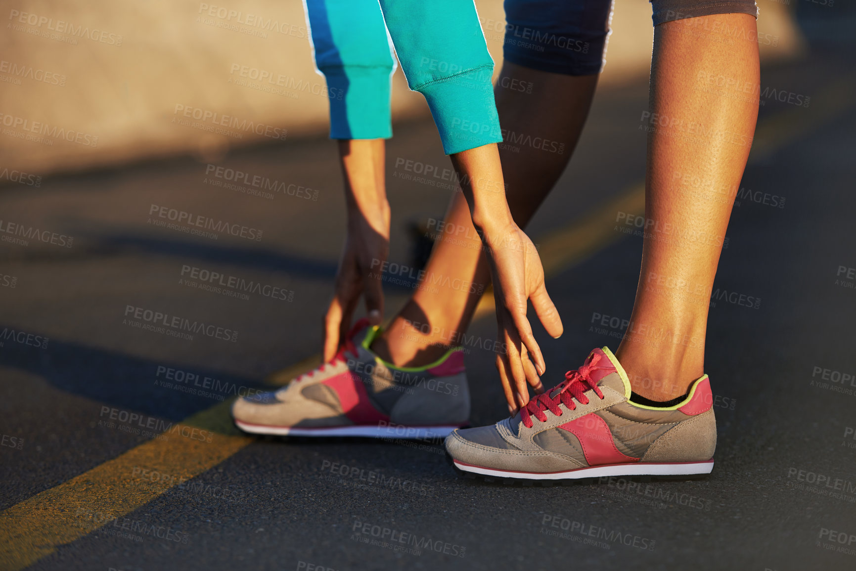 Buy stock photo Runner, stretching and legs on road for fitness, sneakers and ready for exercise. Athlete, person or hands on feet in street for wellness, training or running shoes for sport or outdoor activity