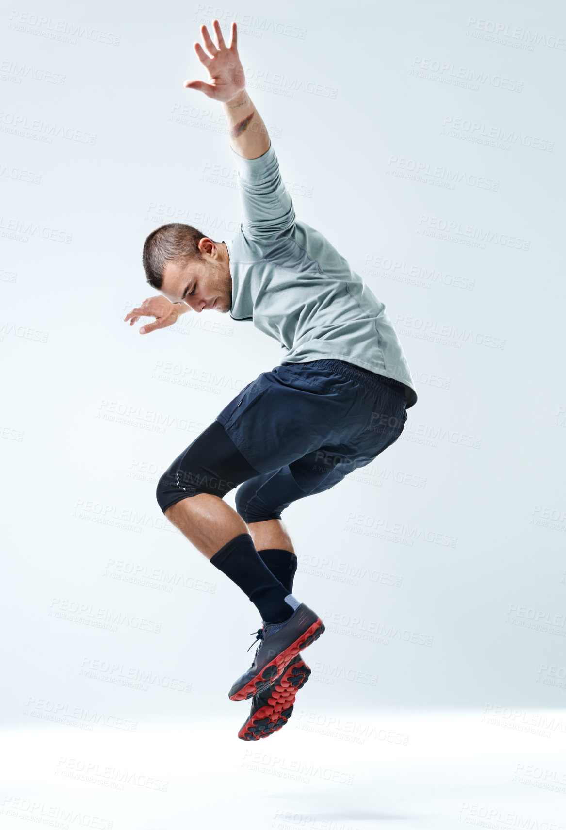 Buy stock photo Fitness, man and jump with exercise in studio for healthy body, workout and muscle strength. Person, sports and athlete in air by white background for performance, challenge or training for self care