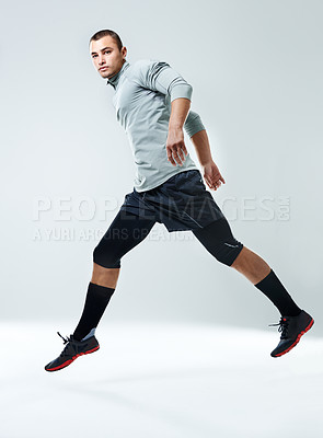 Buy stock photo Fitness, man and jump with portrait in studio for healthy body, workout or muscle strength. Person, exercise and athlete in air by white background for performance, challenge or self care in training