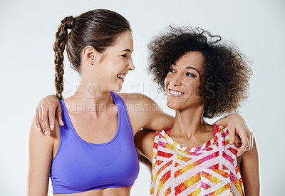 Buy stock photo Happy, hug and women in studio for fitness, exercise and training for health, wellness and workout. Friends, smile and isolated people embrace for bonding, fun and support on white background