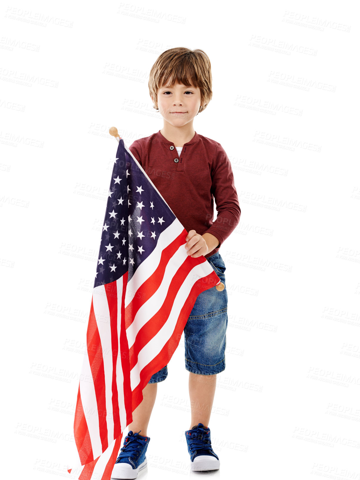 Buy stock photo America, flag and portrait of child in studio for government, patriotism and pride in country. Little kid, pride and relax with fabric by white background for political elections, voting or democracy