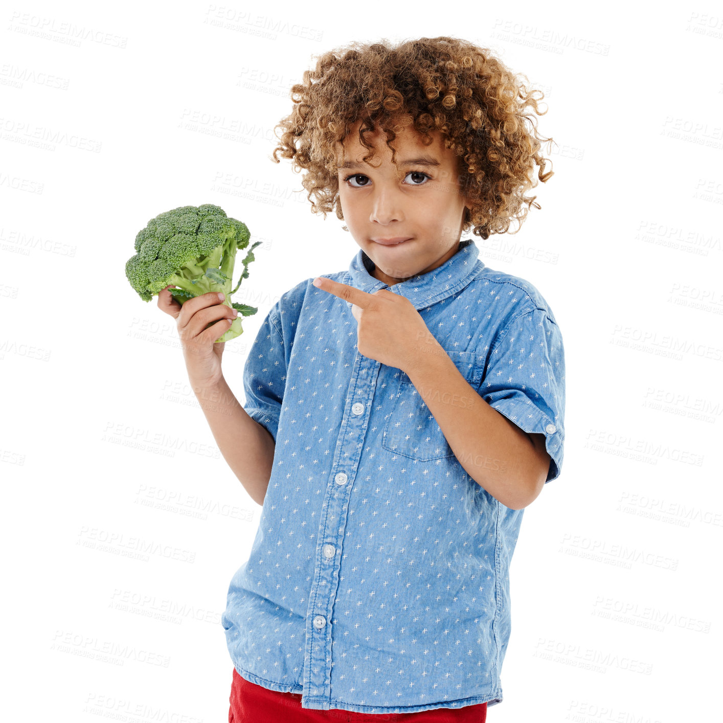 Buy stock photo Young child, portrait and pointing with broccoli for vegetable nutrition, healthy snack or vitamins on a white studio background. Boy, kid or vegeterian with natural or green organic food for fiber