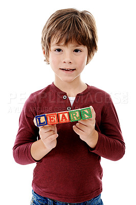 Buy stock photo Happy, studio and portrait of boy with building blocks for learning, education or child development. Creative, childhood and isolated young kid with school toys for spelling games on white background