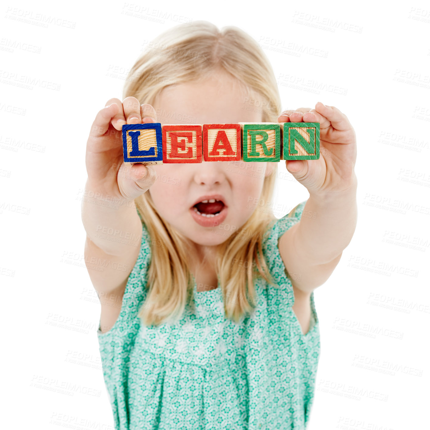 Buy stock photo Building blocks, learning and kid in studio for creative skills, education and development. Kindergarten, childhood and isolated young girl with school toys for spelling games on white background