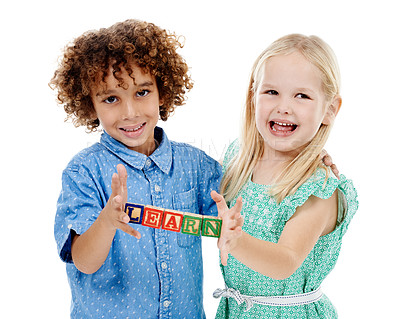 Buy stock photo Happy children, portrait and wooden blocks with alphabet for education, learning or development on a white studio background. Young, boy and girl with smile for childhood growth or kindergarten youth