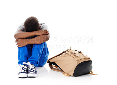 Buy stock photo Studio, sad and child with schoolbag for education, frustrated and back to school by backdrop. Mockup space, boy or student with depression for bullying, looking down and stress by white background