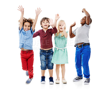 Buy stock photo Joy, jumping and portrait of children in studio for diversity, friends and playing. Happiness, youth and smile with group of kids isolated on white background for celebration, playful and energy