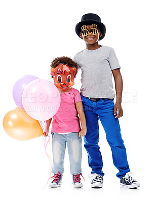 Buy stock photo Children, party and balloons with event, celebration and birthday decoration and mask in studio. Youth, Halloween outfit and fun costume with kids fashion and cute clothes with white background