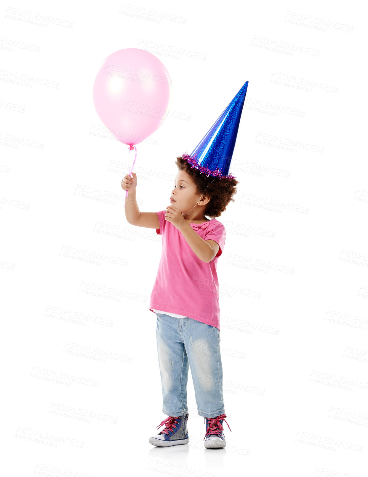 Buy stock photo Balloon, party hat and girl child in studio for birthday, celebration or fun with event. Smile, decoration and kid with flying inflatable helium accessory for gift isolated by white background.