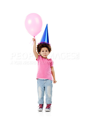 Buy stock photo Balloon, party hat and portrait of kid in studio for birthday, celebration or fun with event. Smile, decoration and child with flying inflatable helium accessory for gift isolated by white background