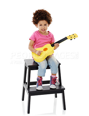 Buy stock photo Happy, guitar and portrait of child in studio on step for playing music, practice and learning songs. Childhood, creative and isolated young girl with musical instrument for sound on white background