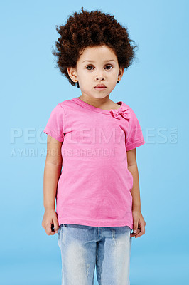 Buy stock photo Portrait of an adorable little girl standing over a blue background