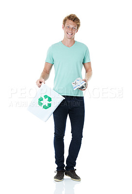 Buy stock photo A handsome young red-headed man ready to throw away a piece of paper in the recycling bin - portrait