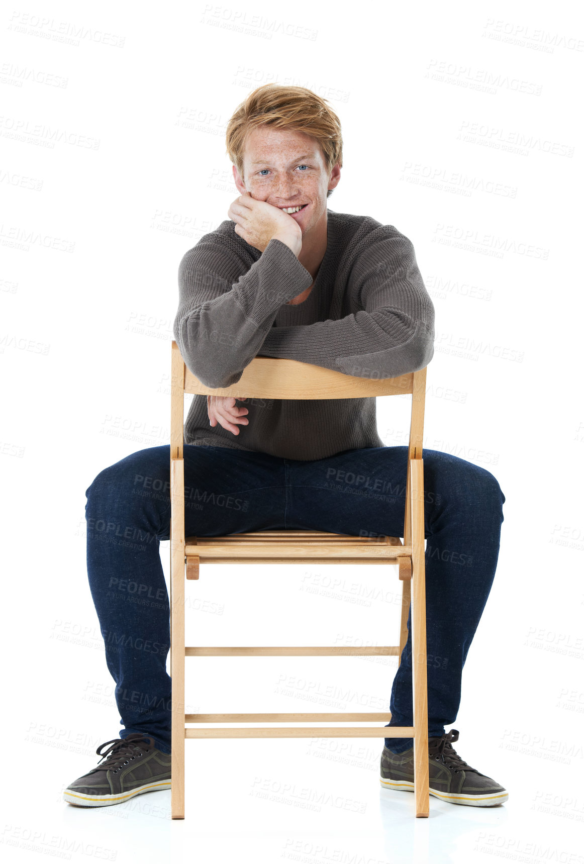 Buy stock photo Chair, redhead and portrait of happy man in studio with freckles, pride and positive attitude. Fashion, confident and isolated person in trendy sweater, style and casual clothes on white background