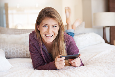 Buy stock photo Teenager, girl and smartphone with games and relax in bedroom, smile in portrait with technology and esports. Young female person at home, gaming and mobile app with happiness, gen z and internet