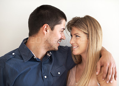 Buy stock photo Love, hugging and couple in studio with happiness, marriage and romantic connection in living room. Smile, people and man and woman embracing and bonding in relationship together by white background.