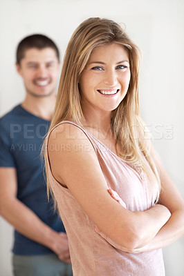 Buy stock photo Smile, portrait and couple having fun in living room with arms crossed, pose and laughing in their home together. Face, happy woman and man bond of day off in their house, proud and chilling together