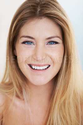 Buy stock photo Cropped head and shoulders portrait of a beautiful young nude woman smiling