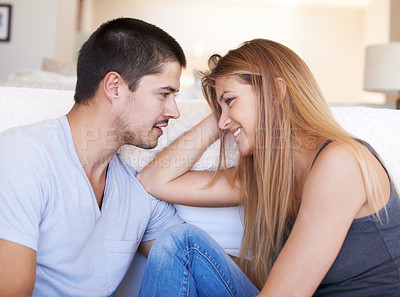 Buy stock photo Talk, relax and couple bond on a sofa with conversation, gossip and hangout in their home together. Love, smile and happy woman with man in a living room with care, happy and soulmate connection