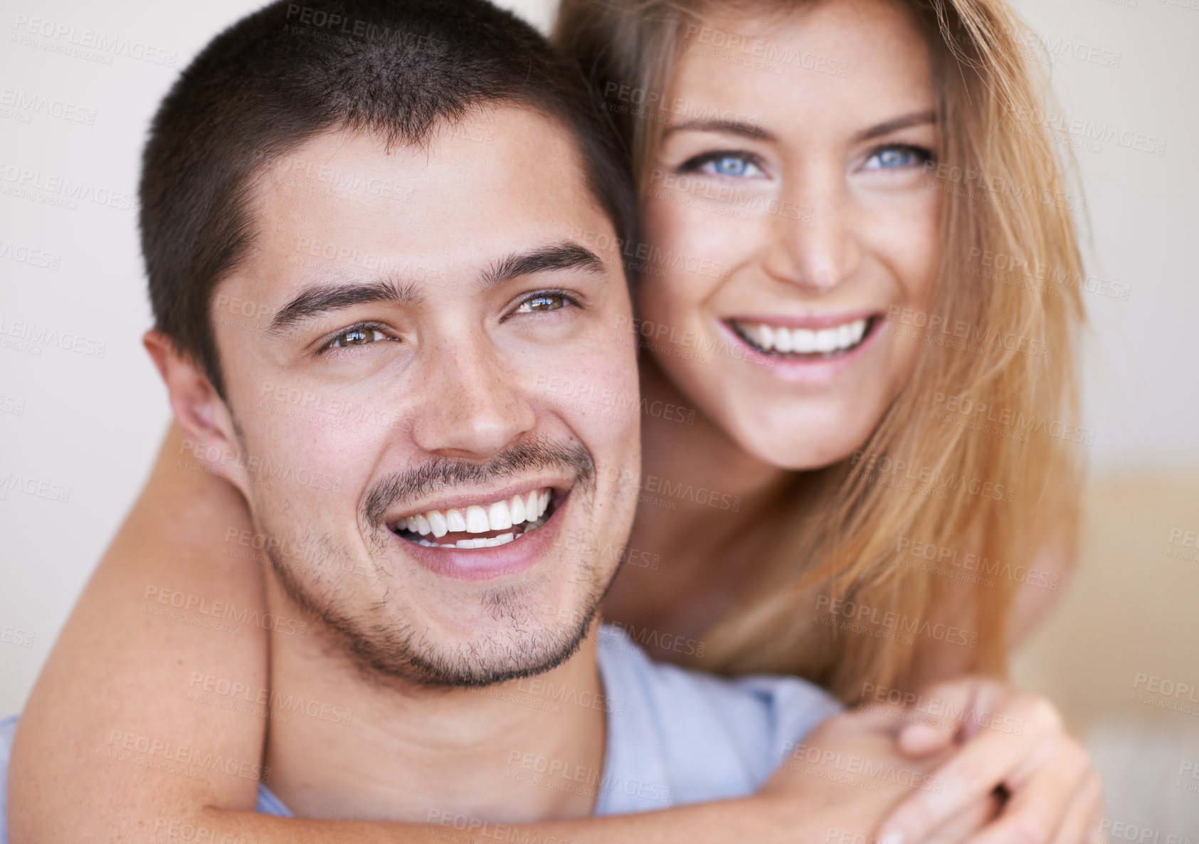 Buy stock photo Love, hugging and couple in home with happiness, marriage and romantic connection in living room. Smile, people and man and woman embracing, relaxing and bonding in relationship together in house.