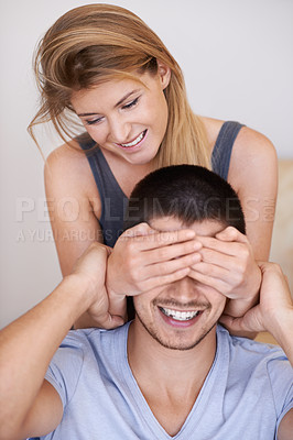 Buy stock photo Playful young couple spending time together at home