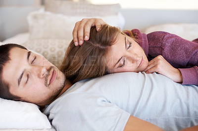 Buy stock photo Attractive young couple lying together at home