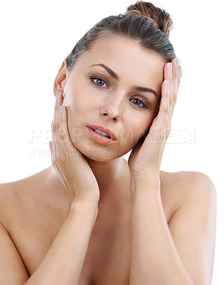 Buy stock photo Gorgeous young woman touching her skin while isolated on a white background
