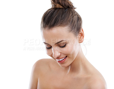 Buy stock photo Beautiful young woman looking down while isolated on a white background