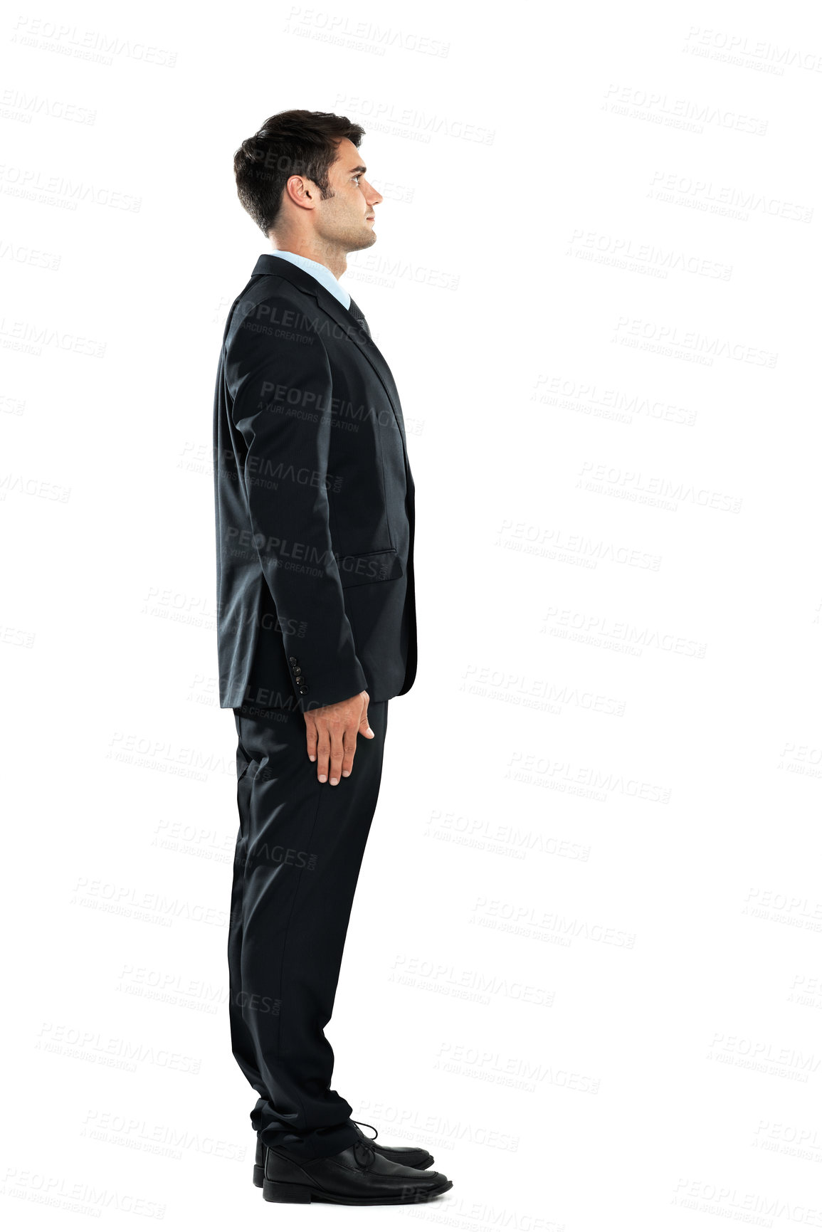 Buy stock photo Serious, successful and young businessman standing isolated on a white background in a studio. Side profile, confident and office worker in a suit for work on a studio background with mockup space