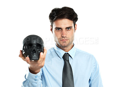 Buy stock photo Portrait, black skull and hand of businessman in studio for magic and spooky on white background. Research, human and head by young male thinking, planning and vision for abstract goal while isolated