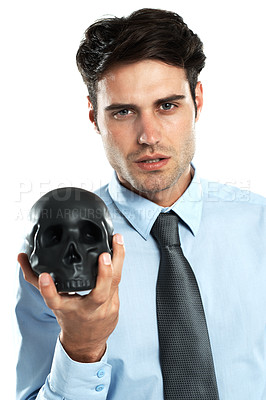 Buy stock photo Portrait, businessman and black skull in hand in studio for death, symbol and failure on a white background. Face, man and skeleton for research, emoji and magic, hypnosis or horror, end and isolated