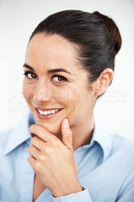 Buy stock photo Beautiful businesswoman looking at the camera while thinking against a white background