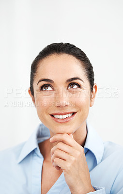 Buy stock photo Beautiful businesswoman looking upwards while thinking against a white background
