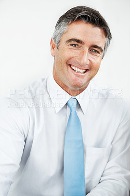 Buy stock photo Handsome mature businessman smiling against a white background