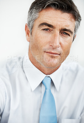 Buy stock photo Handsome mature businessman against a white background