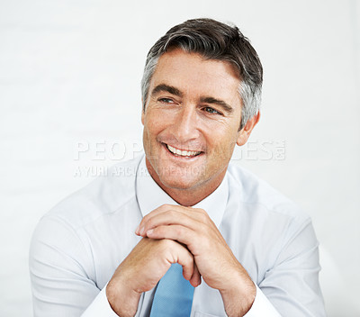Buy stock photo Thoughtful mature businessman looking away with a smile