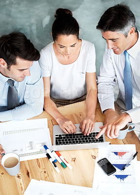 Buy stock photo Group of businesspeople working together on a project