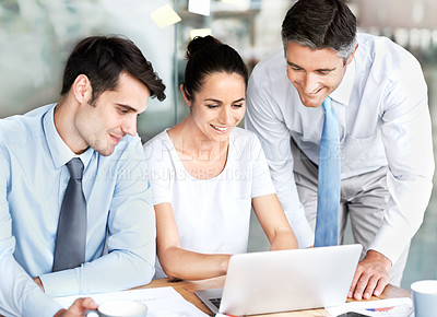 Buy stock photo Business people, team and talking at laptop in office for planning, collaboration and discussion. Men and a woman leader together at desk with tech for tax, budget or brainstorming corporate strategy