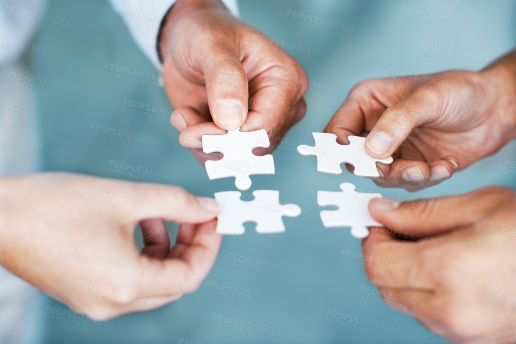 Buy stock photo Hands of business people, challenge and teamwork with puzzle for problem solving, growth or development. Partnership, synergy and colleagues in office with jigsaw in meeting for solution or closeup