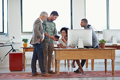 Buy stock photo A group of coworkers working together in the office